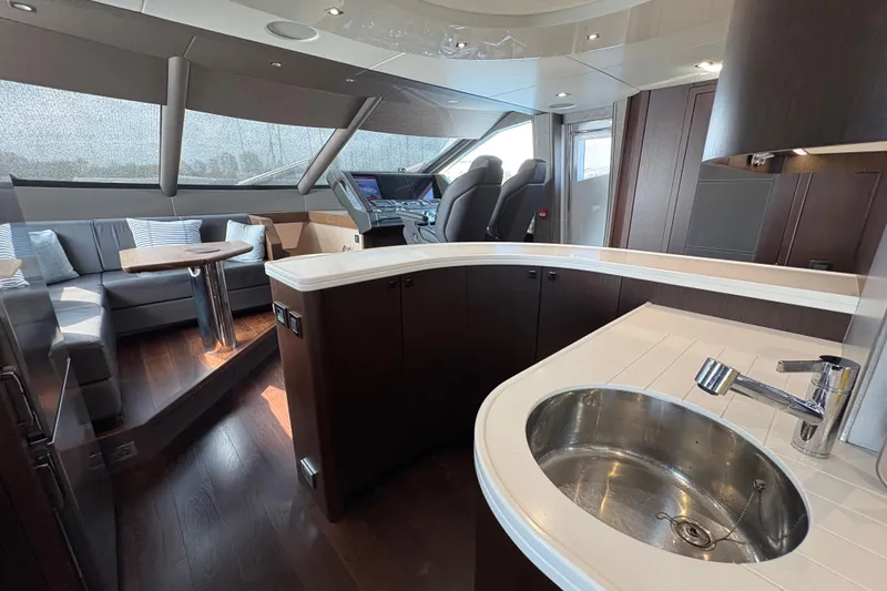  Yacht Photos Pics Luxurious interior of 2018 Sunseeker 86 Yacht with modern kitchen and seating area.