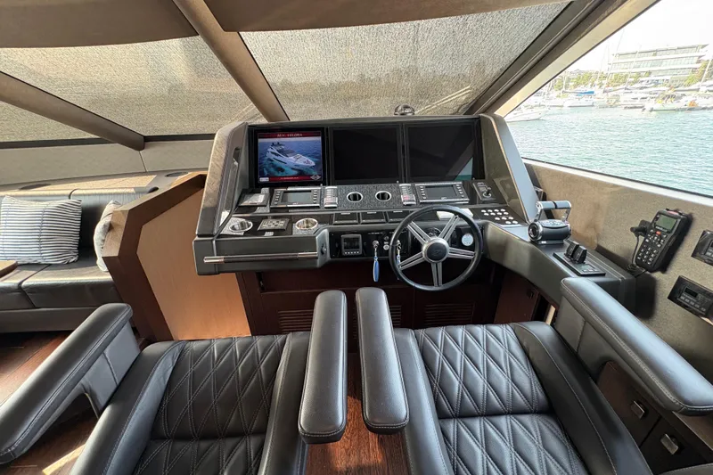  Yacht Photos Pics Luxurious 2018 Sunseeker 86 Yacht helm with advanced navigation controls and plush seating.