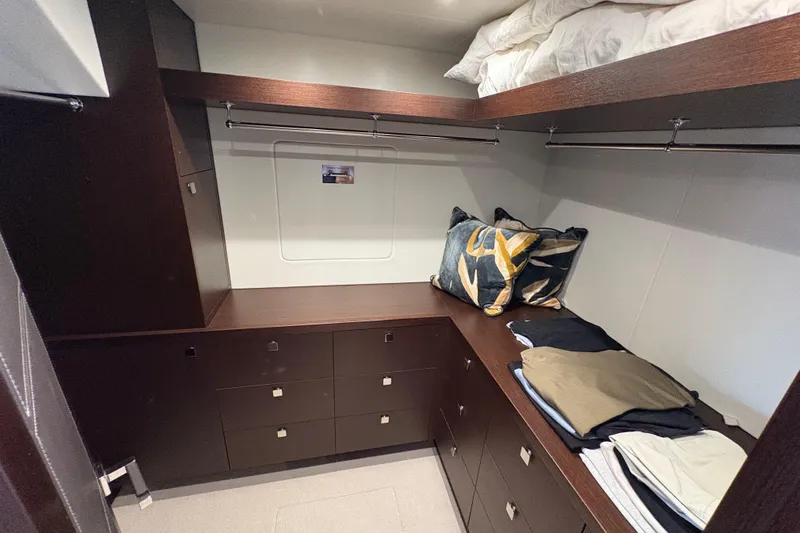  Yacht Photos Pics Luxurious Sunseeker 86 Yacht 2018 interior with elegant wood cabinetry and cozy bedding.