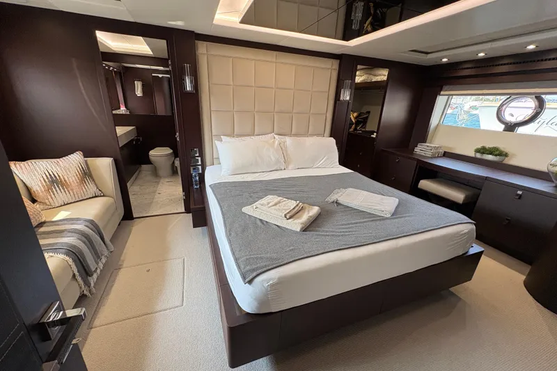  Yacht Photos Pics Luxurious bedroom interior of 2018 Sunseeker 86 Yacht with modern furnishings and elegant decor.