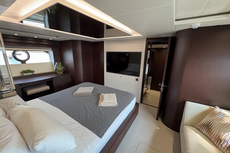  Yacht Photos Pics Luxurious bedroom interior of 2018 Sunseeker 86 Yacht with modern decor and elegant furnishings.
