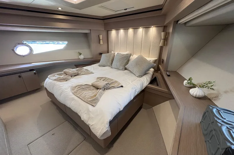  Yacht Photos Pics Luxurious bedroom interior of 2018 Sunseeker 86 Yacht with elegant decor and natural light.