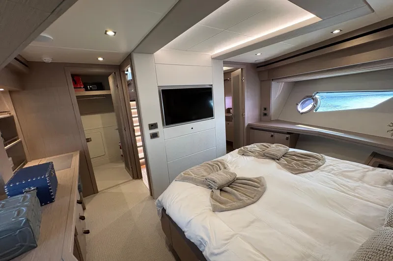  Yacht Photos Pics Luxurious bedroom interior of 2018 Sunseeker 86 Yacht with modern amenities and elegant design.