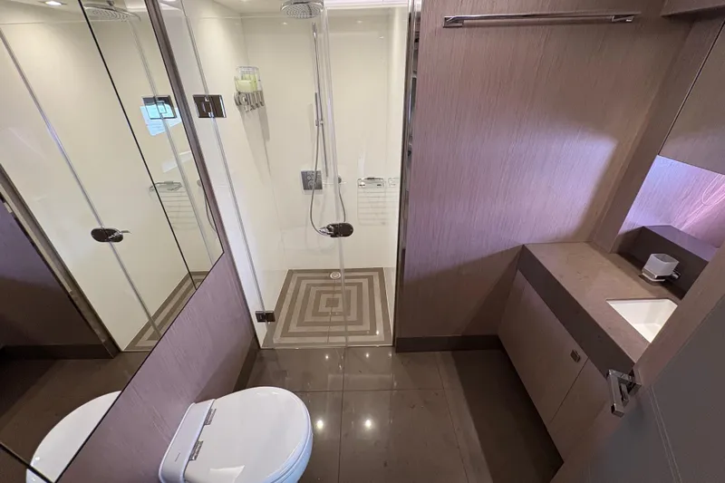  Yacht Photos Pics Luxurious bathroom on a 2018 Sunseeker 86 Yacht, featuring modern fixtures and elegant design.