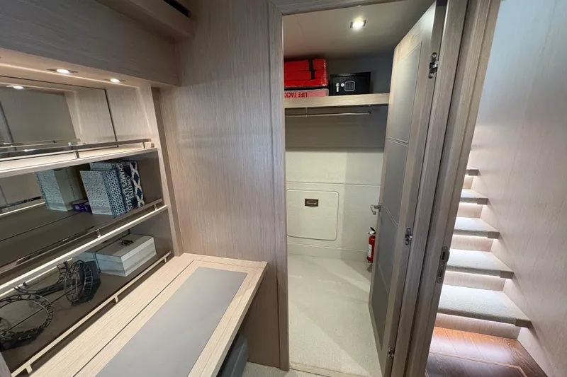  Yacht Photos Pics Luxurious interior of 2018 Sunseeker 86 Yacht with modern storage and lighting.