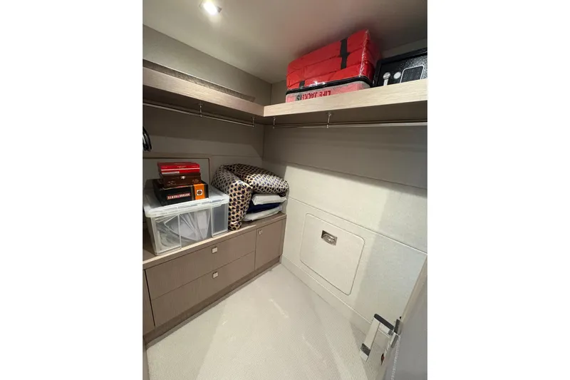  Yacht Photos Pics Storage area in a 2018 Sunseeker 86 Yacht, featuring shelves and organized items.