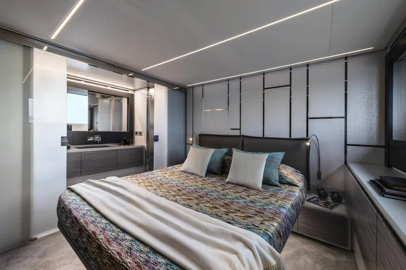  Yacht Photos Pics Luxurious bedroom interior of 2023 Pershing 6X yacht with modern design and elegant decor.