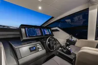 2023 Pershing 6X yacht cockpit with advanced navigation systems and modern design.
