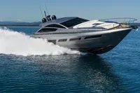 2023 Pershing 6X yacht cruising on open water, showcasing sleek design and speed.