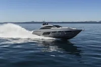2023 Pershing 6X yacht cruising on open water, showcasing sleek design and speed.