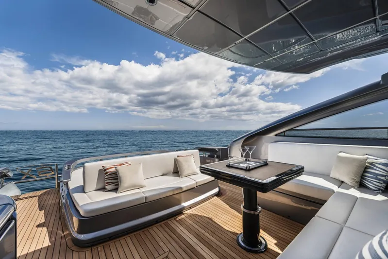  Yacht Photos Pics Luxury deck of 2023 Pershing 6X yacht with ocean view and elegant seating.