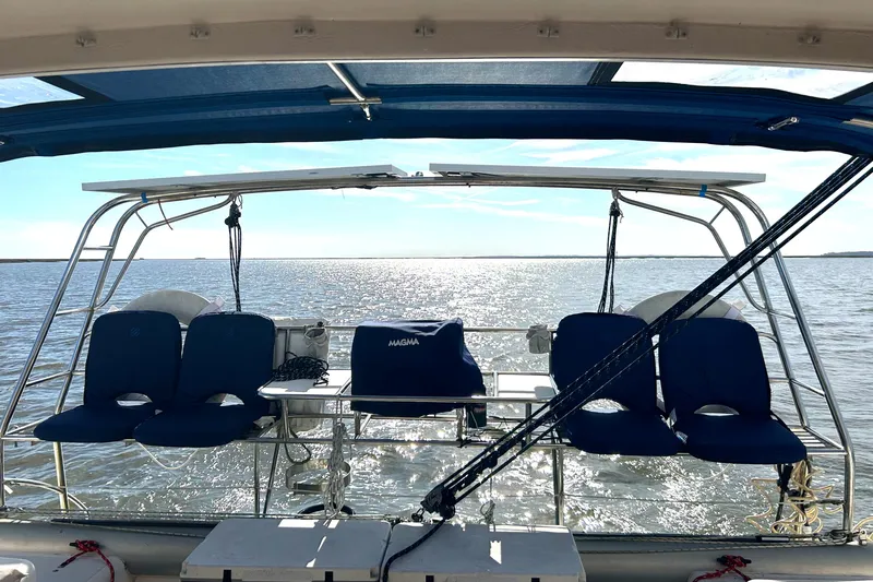 Prosecco Yacht Photos Pics Seawind 1000 catamaran, 1997 model, with blue seating, sailing on a sunny day.