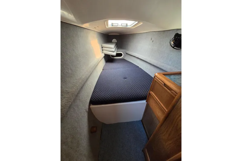 Prosecco Yacht Photos Pics Interior cabin of a 1997 Seawind 1000 catamaran, featuring a cozy sleeping area.
