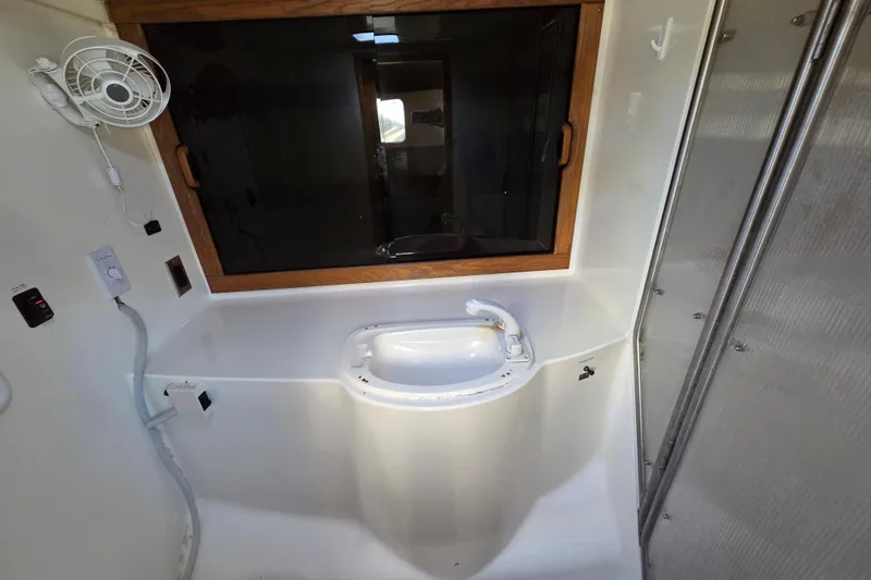 Prosecco Yacht Photos Pics Bathroom interior of 1997 Seawind 1000 catamaran with sink and window.