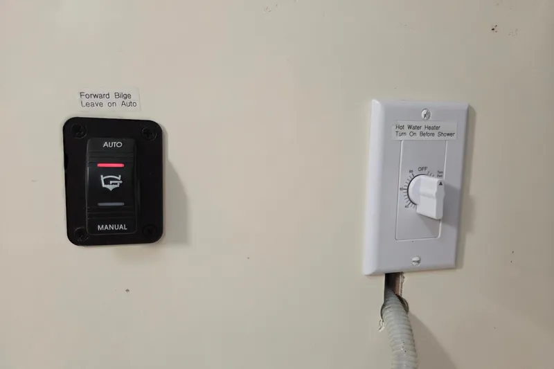 Prosecco Yacht Photos Pics Control panel of a 1997 Seawind 1000 with bilge and water heater switches.