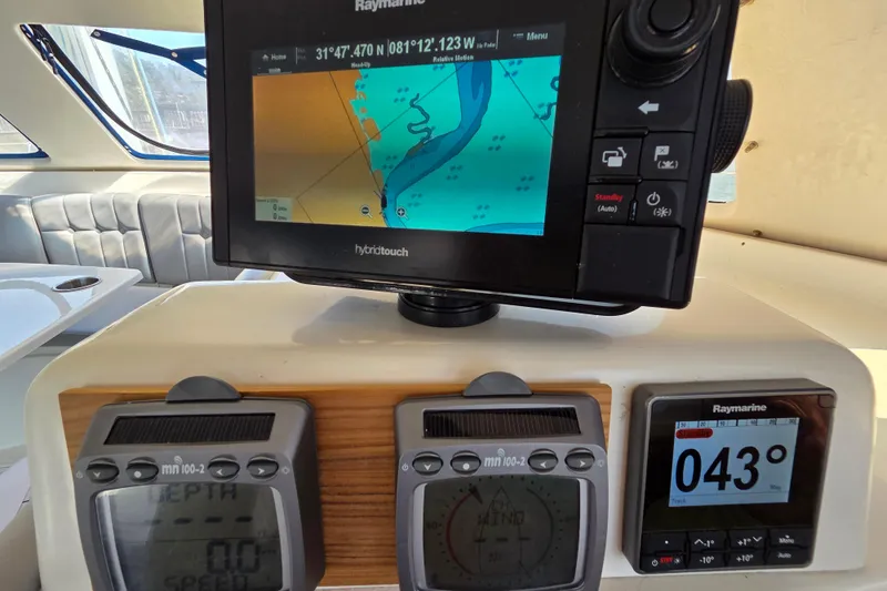 Prosecco Yacht Photos Pics Navigation equipment on a 1997 Seawind 1000 catamaran, featuring Raymarine displays and controls.
