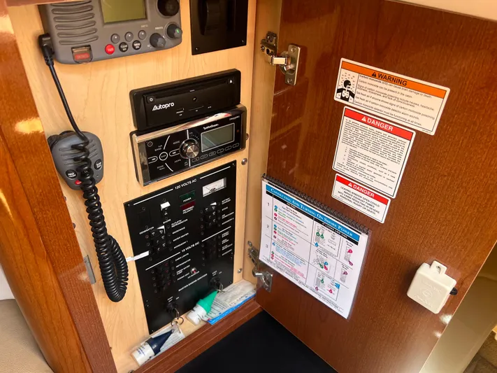 Freedom Of The Seize Yacht Photos Pics Control panel and radio equipment inside a 2014 Sea Ray 330 Sundancer boat.