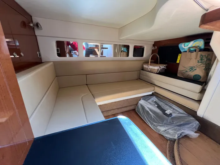 Freedom Of The Seize Yacht Photos Pics Interior cabin of a 2014 Sea Ray 330 Sundancer yacht with seating and storage.