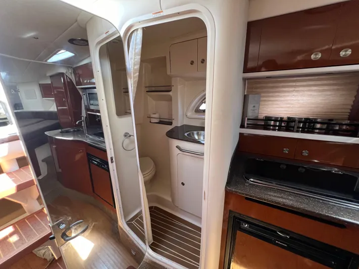 Freedom Of The Seize Yacht Photos Pics Interior of 2014 Sea Ray 330 Sundancer yacht with kitchen and bathroom.
