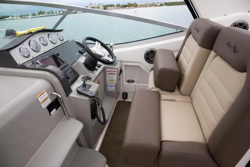 Freedom Of The Seize Yacht Photos Pics 2014 Sea Ray 330 Sundancer helm with dual seating and modern controls.