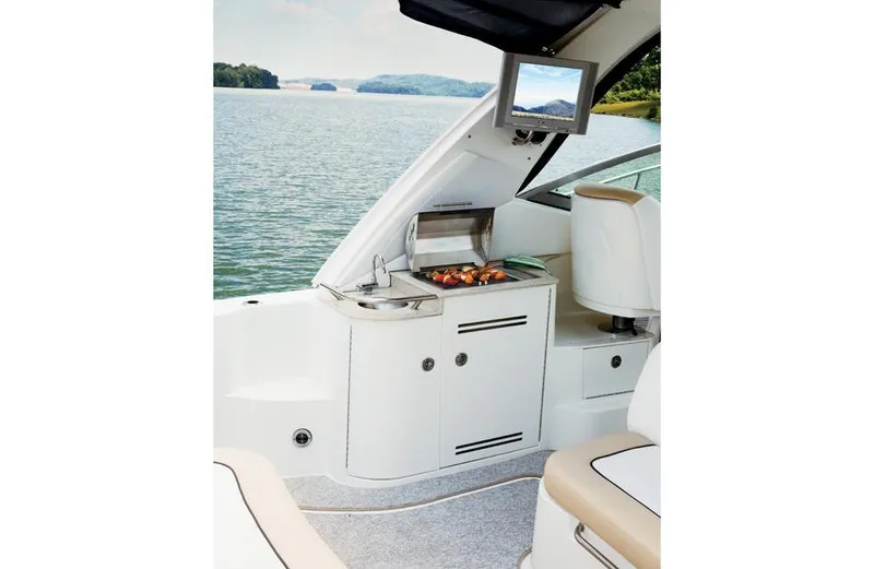 Freedom Of The Seize Yacht Photos Pics 2014 Sea Ray 330 Sundancer boat interior with grill and lake view.