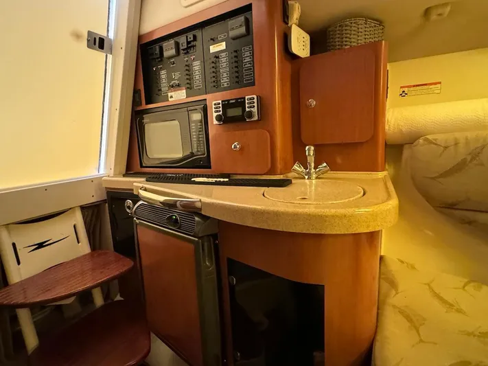  Yacht Photos Pics 2006 Hydra-Sports 3300 VX cabin interior with kitchenette and control panel.