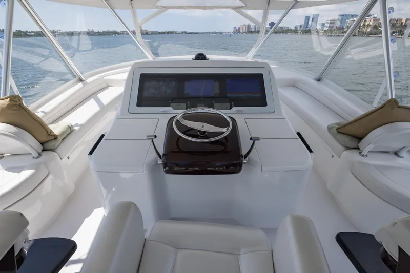 "el Jefe" Yacht Photos Pics Cockpit of 2014 Viking 70 Convertible yacht with modern steering and navigation system.