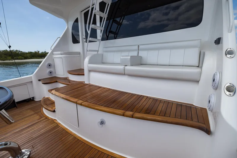 "el Jefe" Yacht Photos Pics 2014 Viking 70 Convertible yacht with teak deck and white seating area.