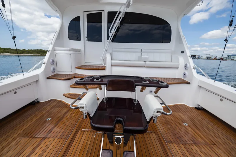 "el Jefe" Yacht Photos Pics 2014 Viking 70 Convertible yacht cockpit with teak flooring and fishing chair.