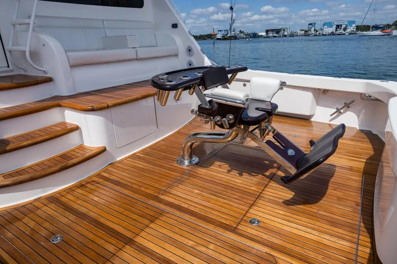 "el Jefe" Yacht Photos Pics Luxurious 2014 Viking 70 Convertible yacht deck with fishing chair and teak flooring.