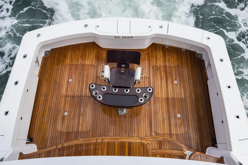 "el Jefe" Yacht Photos Pics 2014 Viking 70 Convertible yacht deck with polished wood finish and fishing chair.
