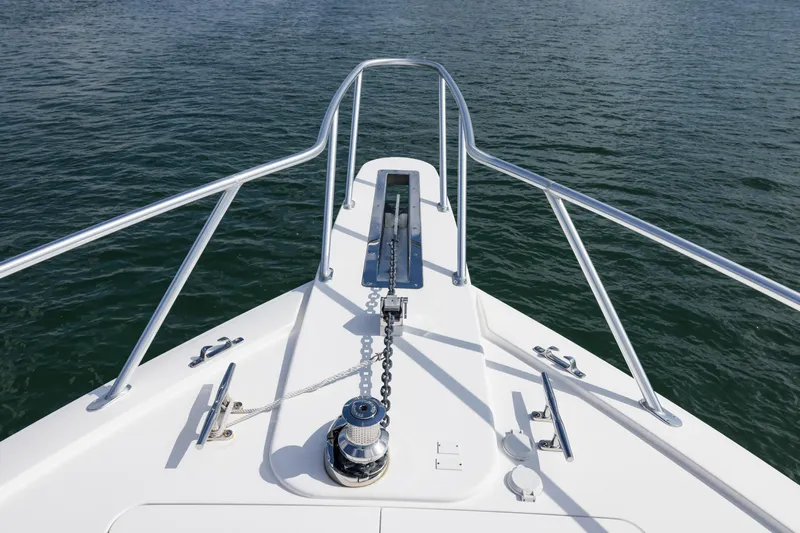 "el Jefe" Yacht Photos Pics Bow of 2014 Viking 70 Convertible yacht with anchor chain and railing.