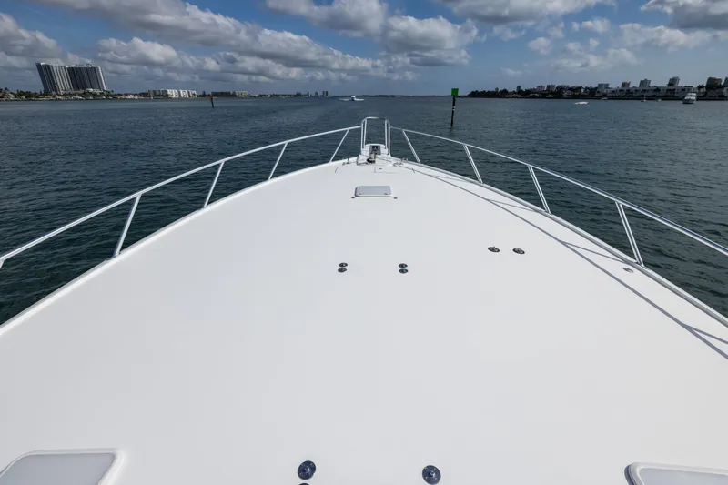 "el Jefe" Yacht Photos Pics Bow view of 2014 Viking 70 Convertible yacht cruising on a sunny day.