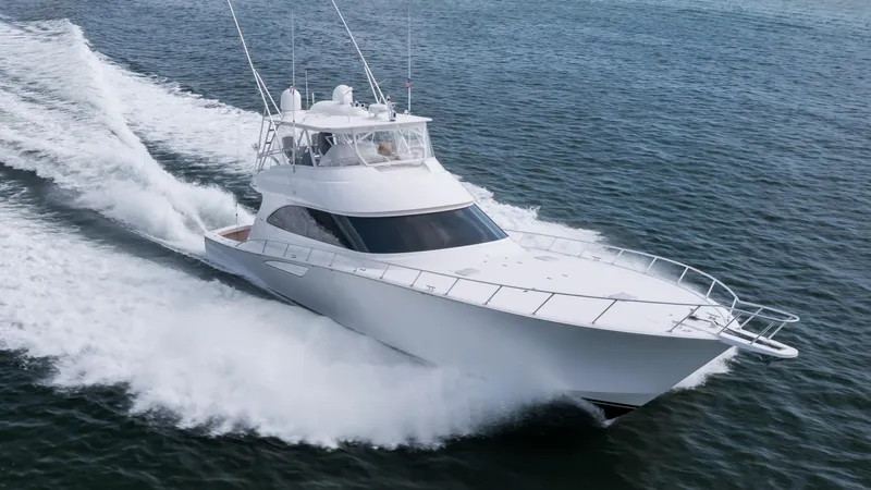 "el Jefe" Yacht Photos Pics 2014 Viking 70 Convertible yacht cruising swiftly on open water.