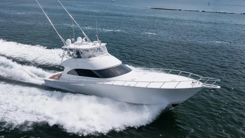 "el Jefe" Yacht Photos Pics 2014 Viking 70 Convertible yacht cruising swiftly on open water.