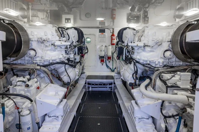 "el Jefe" Yacht Photos Pics Engine room of 2014 Viking 70 Convertible yacht, showcasing dual engines and mechanical systems.