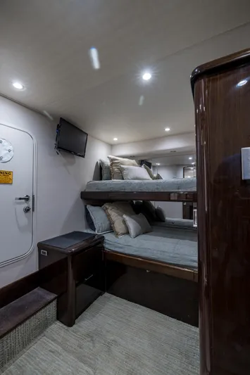 "el Jefe" Yacht Photos Pics Interior of 2014 Viking 70 Convertible yacht with bunk beds and modern lighting.