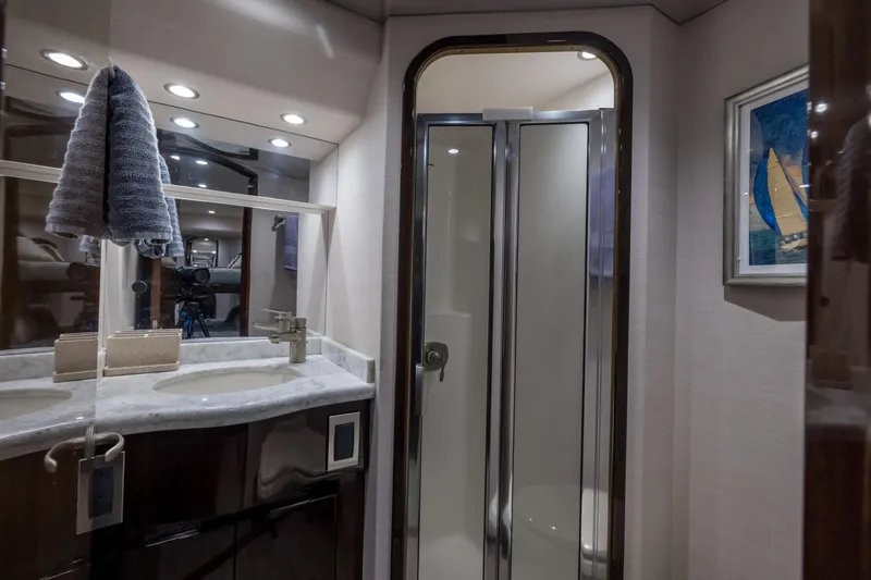 "el Jefe" Yacht Photos Pics Luxurious bathroom in 2014 Viking 70 Convertible yacht with modern fixtures and shower.