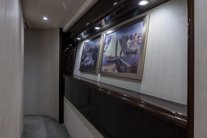 "el Jefe" Yacht Photos Pics Hallway in 2014 Viking 70 Convertible yacht with framed nautical artwork.