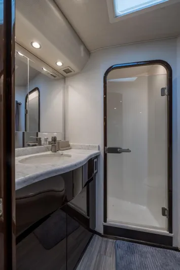 "el Jefe" Yacht Photos Pics Luxurious bathroom in 2014 Viking 70 Convertible yacht with modern fixtures and shower.
