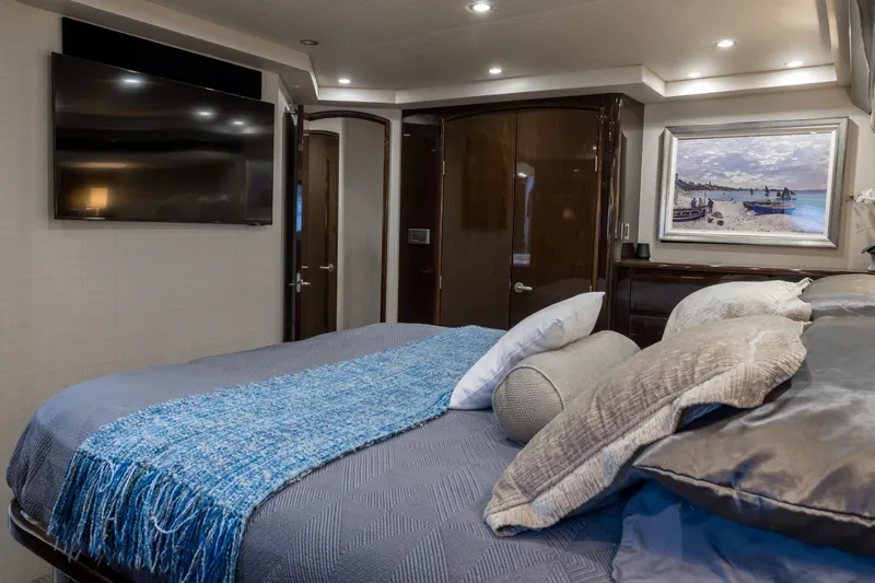 "el Jefe" Yacht Photos Pics Luxurious bedroom interior of 2014 Viking 70 Convertible yacht with modern decor.