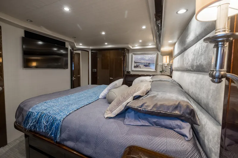 "el Jefe" Yacht Photos Pics Luxurious bedroom interior of 2014 Viking 70 Convertible yacht with modern decor.