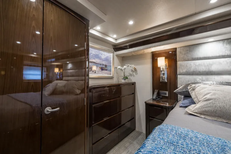 "el Jefe" Yacht Photos Pics Luxurious bedroom interior of 2014 Viking 70 Convertible yacht with elegant wood finishes.