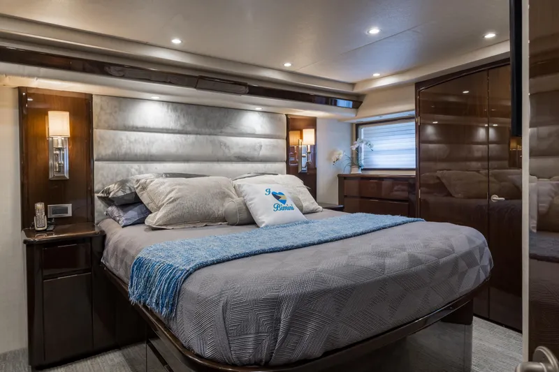 "el Jefe" Yacht Photos Pics Luxurious bedroom interior of a 2014 Viking 70 Convertible yacht with elegant bedding.