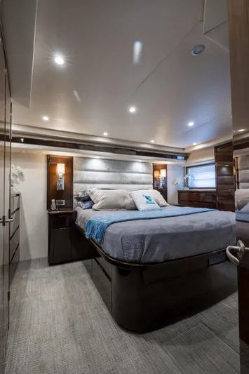 "el Jefe" Yacht Photos Pics Luxurious bedroom interior of 2014 Viking 70 Convertible yacht with modern lighting and elegant decor.