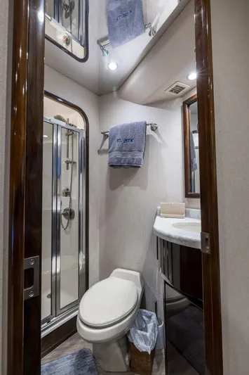 "el Jefe" Yacht Photos Pics Luxurious bathroom in 2014 Viking 70 Convertible yacht with modern fixtures and shower.