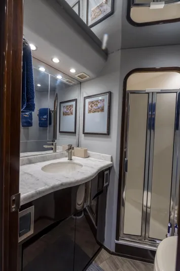 "el Jefe" Yacht Photos Pics Luxurious bathroom in 2014 Viking 70 Convertible yacht with modern fixtures and elegant decor.