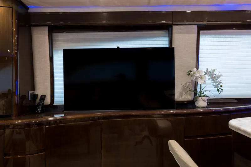 "el Jefe" Yacht Photos Pics Luxurious interior of 2014 Viking 70 Convertible yacht with TV and elegant decor.