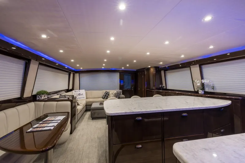 "el Jefe" Yacht Photos Pics Luxurious interior of 2014 Viking 70 Convertible yacht with modern furnishings and ambient lighting.