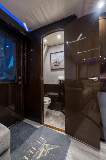 "el Jefe" Yacht Photos Pics Interior of 2014 Viking 70 Convertible yacht, featuring a sleek bathroom design.